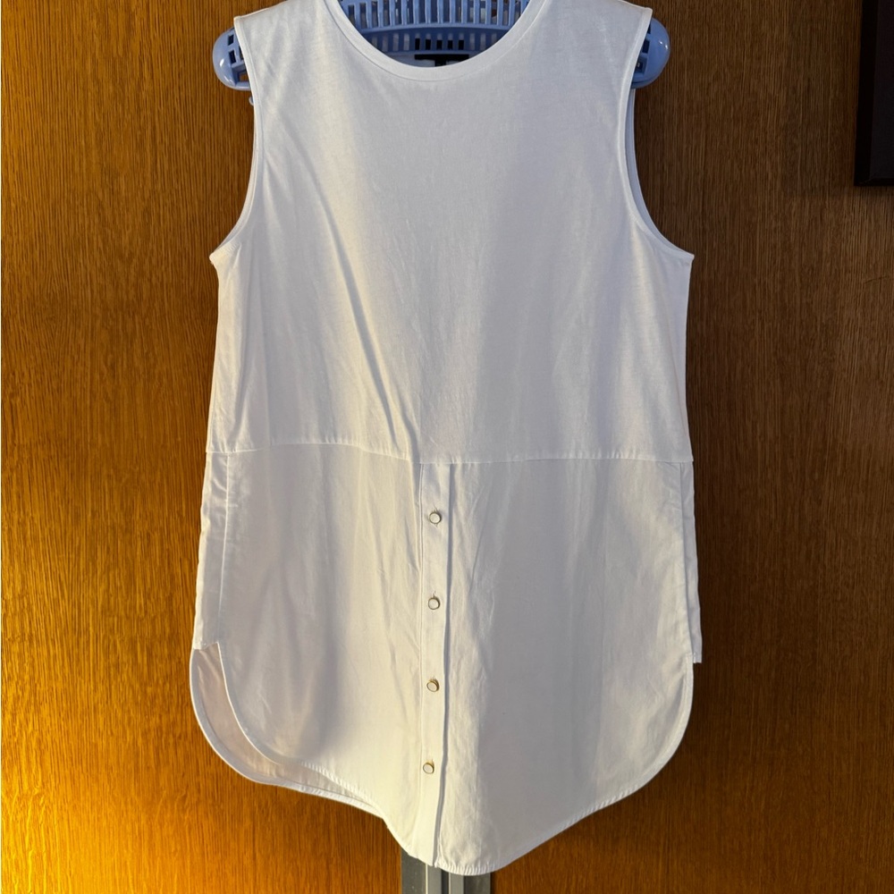 To be worn under sweater or sweatshirt